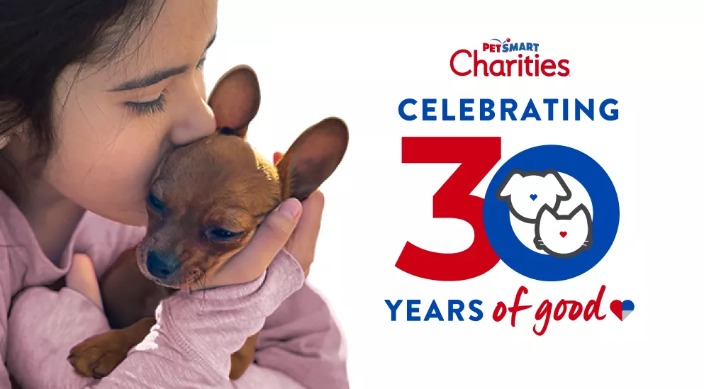 girl kisses Chihuahua and text that reads "PetSmart Charities Celebrating 30 Years of Good" 
